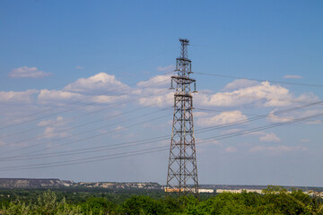 High voltage power line against blue sky