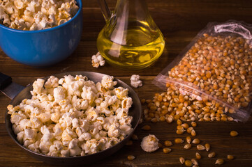 Popcorn on a wooden background. Ingredients