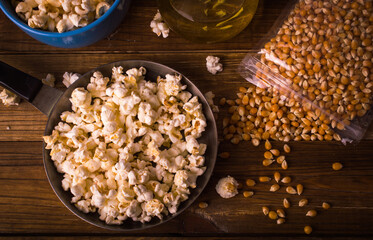 Popcorn on a wooden background. Ingredients. Top view