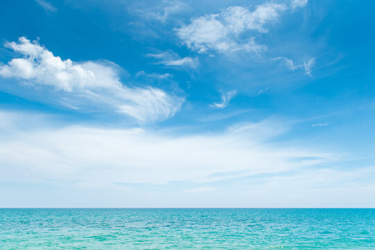 Scenic landscape of turquoise sea , blue sky and white clouds in sunny day, beautiful nature background or backdrop for holiday vacation and summer travel concepts