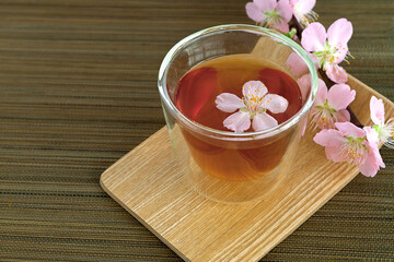 Сup of tea with blossom branch