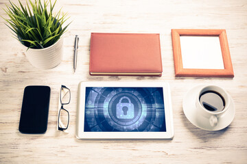 Web security and technology concept with tablet pc on wooden tab