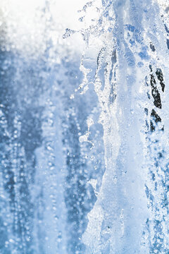 Water jets and a spray of a fountain close up © glebchik