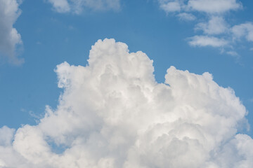Naklejka na ściany i meble White cloud formations on the blue sky. Abstract heaven background with white clouds