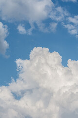 White cloud formations on the blue sky. Abstract heaven background with white clouds