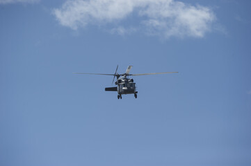 Fototapeta na wymiar Helicopter flying in the sky