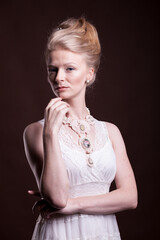 Portrait of Gorgeous beautiful blonde woman in vintage victorian dress. Rich and vintage. Luxury and elegance. Studio photo