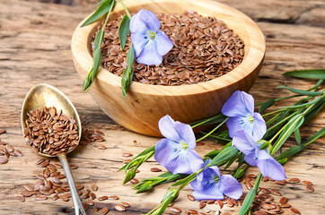 Linseed on wooden background - obrazy, fototapety, plakaty