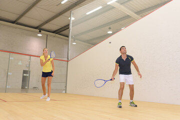couple playing squash