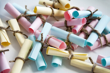 Glass jar with colored notes with blur and toning