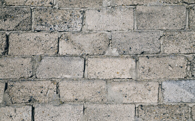 Empty wall of gray slag blocks. Brick background.