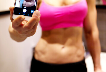 Sportive woman taking selfie.
