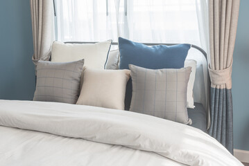 set of pillows on bed in modern bedroom style