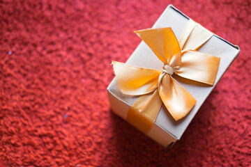 Brown gift box with golden ribbon