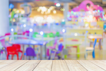 White wooden shelf over blurred toy land background