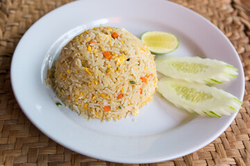 crab meat fried rice with vegetable on white dish