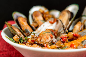 Mussel with white wine sauce on table