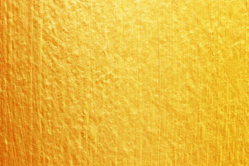 Fototapeta premium Gold paint on cement wall texture. golden texture background