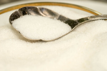 white sugar in spoon
