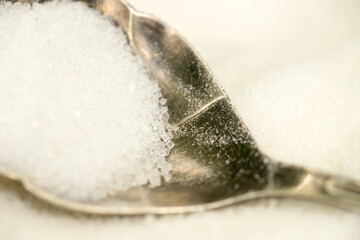 white sugar in spoon