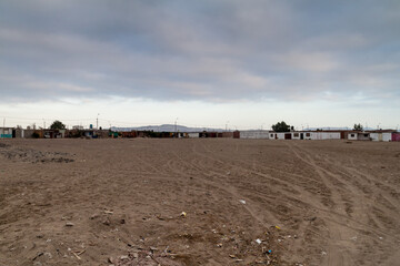 Square in a poor neighborhood of Paracas town, Peru