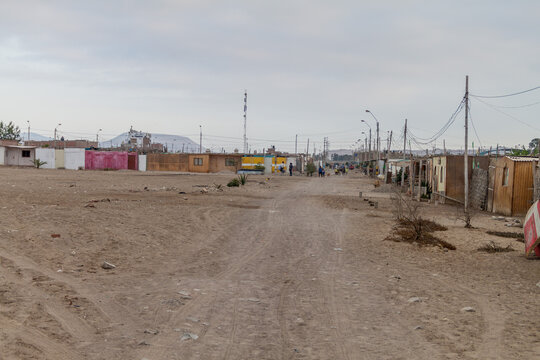PARACAS, PERU - JUNE 2, 2015: Street in a poor neighborhood of Paracas town, Peru