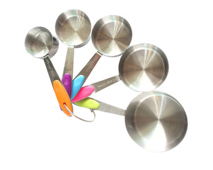 Set of stainless steel measuring spoons on white background with clipping path