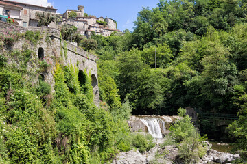 Fototapeta na wymiar Bagnone town with river and waterfall. Scenic Italy, Lunigiana, north Tuscany