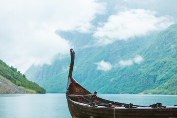 Old wooden viking boat in norwegian nature