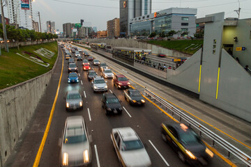 Obraz premium LIMA, PERU - JUNE 4, 2015: Metropolitano rapid transport bus system station on Paseo de la Republica road.
