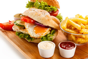 Sandwich with chicken fillet and fried egg 