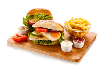 Sandwich with chicken fillet and fried egg 