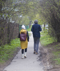 a guy and a girl are on the road back