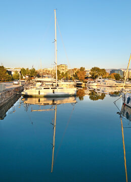 boats reflected on sea at Marina Alimos Attica Greece