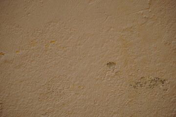 Old white wall with cracks
