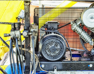 Electrical parts and industrial pipelines of compressor presents closeup