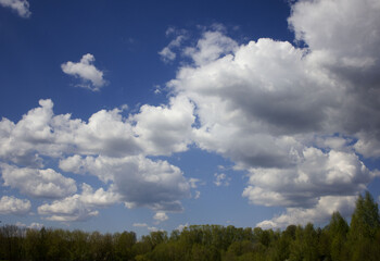 blue sky background with tiny clouds