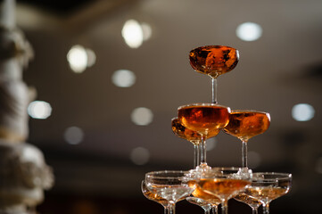 small tower of champagne's glass in wedding reception party..