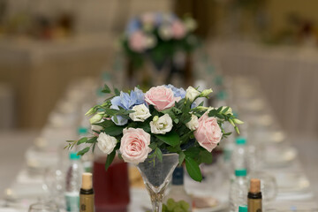 Wedding table decor with flowers and plates