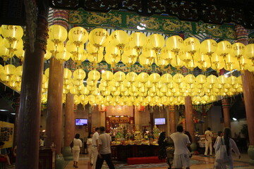 Pay respect to Chinese god in Chinese temple  with yellow golden lamp