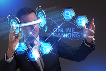 Business, Technology, Internet and network concept. Young businessman working in virtual reality glasses sees the inscription: Online banking