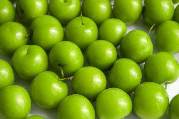 Quality and natural life-giving green sour plums,