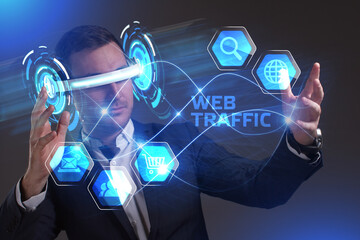 Business, Technology, Internet and network concept. Young businessman working in virtual reality glasses sees the inscription: Web traffic