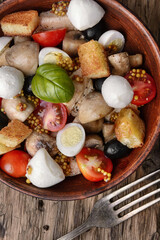 Fototapeta premium Delicious salad with chicken,cheese,and vegetables