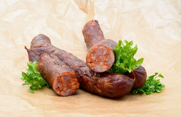 Delicious high quality smoked sausage on a crumpled paper