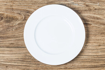 Empty plate on wood