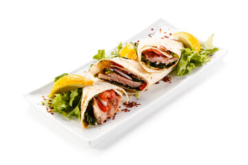 Spring rolls - wraps with meat and vegetables on white background 