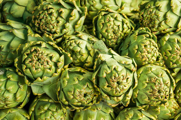 Fototapeta premium Green fruit buds of a plant close-up as a backdrop background or wallpaper.