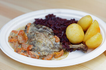 Roasted duck with red cabbage and potato