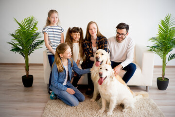 Family playing with a dog